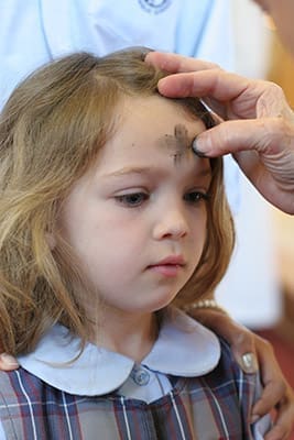 St. Thomas More School student Lily Ryan Walker receives ashes back in 2010. Photo By Michael Alexander