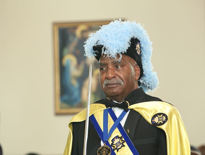 During the opening procession of the Jan. 17 Martin Luther King Jr. Eucharistic Celebration at the Shrine of the Immaculate Conception, Atlanta, Robert Carter stands with the honor guard that included the Knights of Peter Claver and the Knights of Columbus. Photo By Michael Alexander