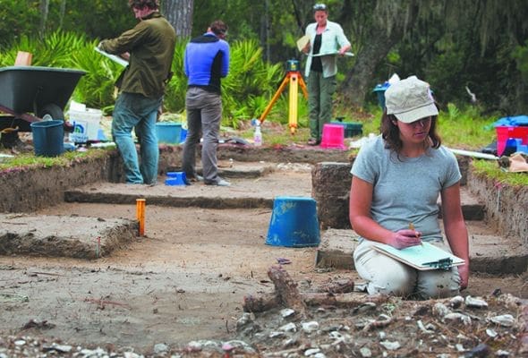Intern Sara Balmuth, right, works alongside archaeologists at a fast-eroding site on St. Catherines Island in Georgia Oct. 14. Scientists on the island continue to excavate with a sense of urgency as erosion from rising sea levels threaten the remains of a vanished American Indian community and a historic mission. CNS photo/Nancy Phelan Wiechec